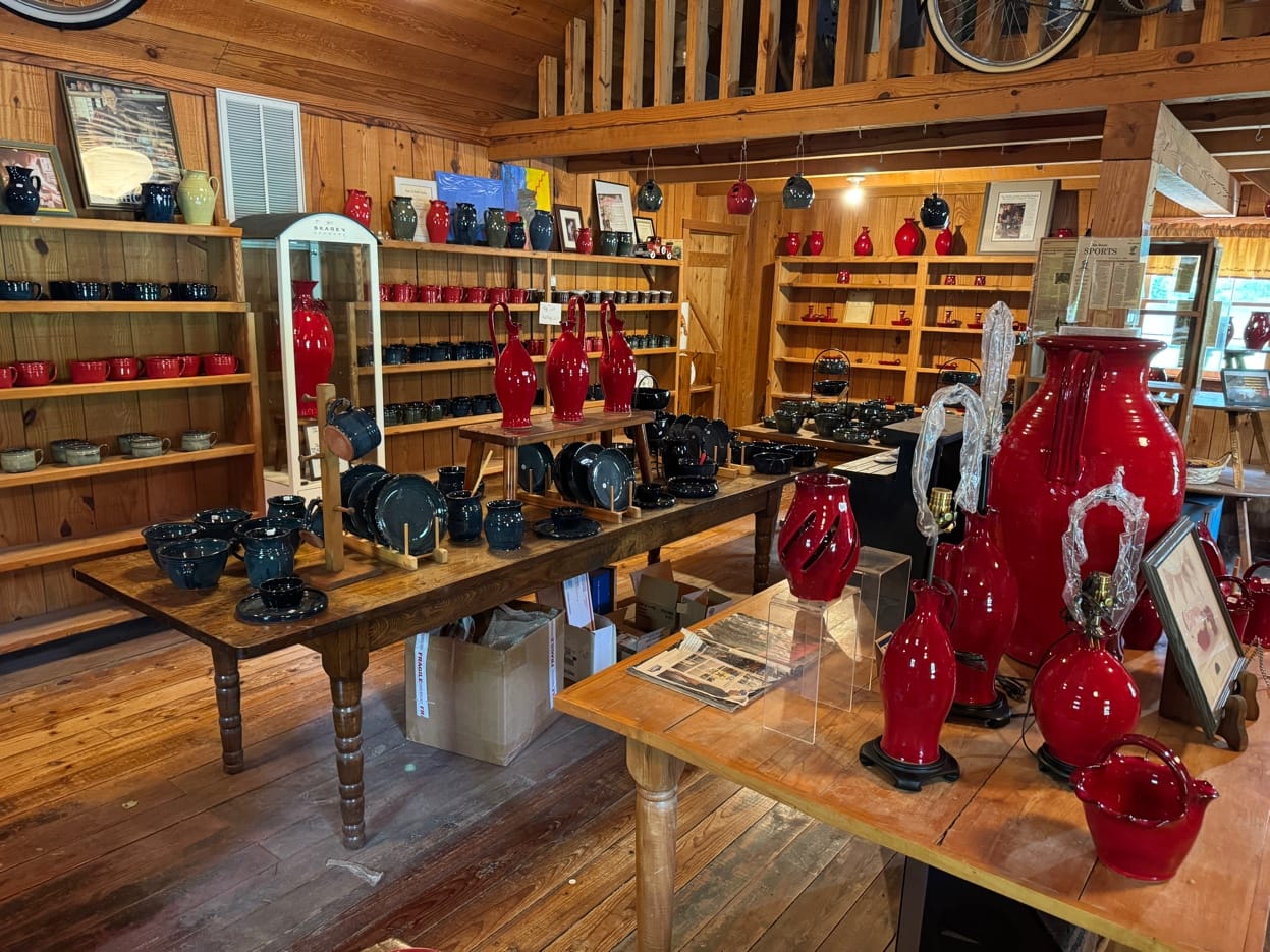 Original Owens Pottery shop interior filled with red pottery